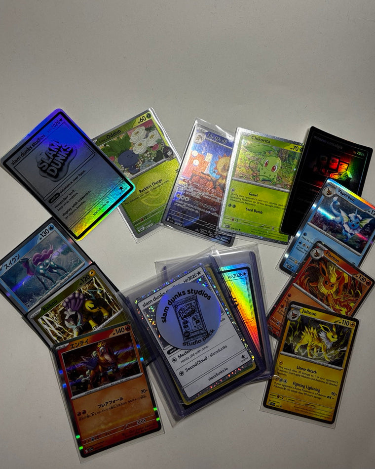 Studio Pack 001 flat lay with holographic Slam Dunks Studios cards and curated trading cards